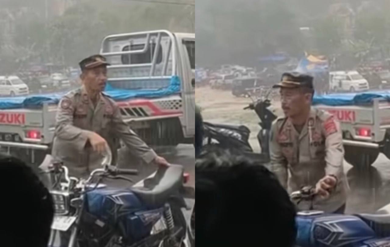 Respect! Polisi Ini Rela Basah Kuyup Demi Urai Kemacetan di Tengah Hujan Deras Seorang Diri