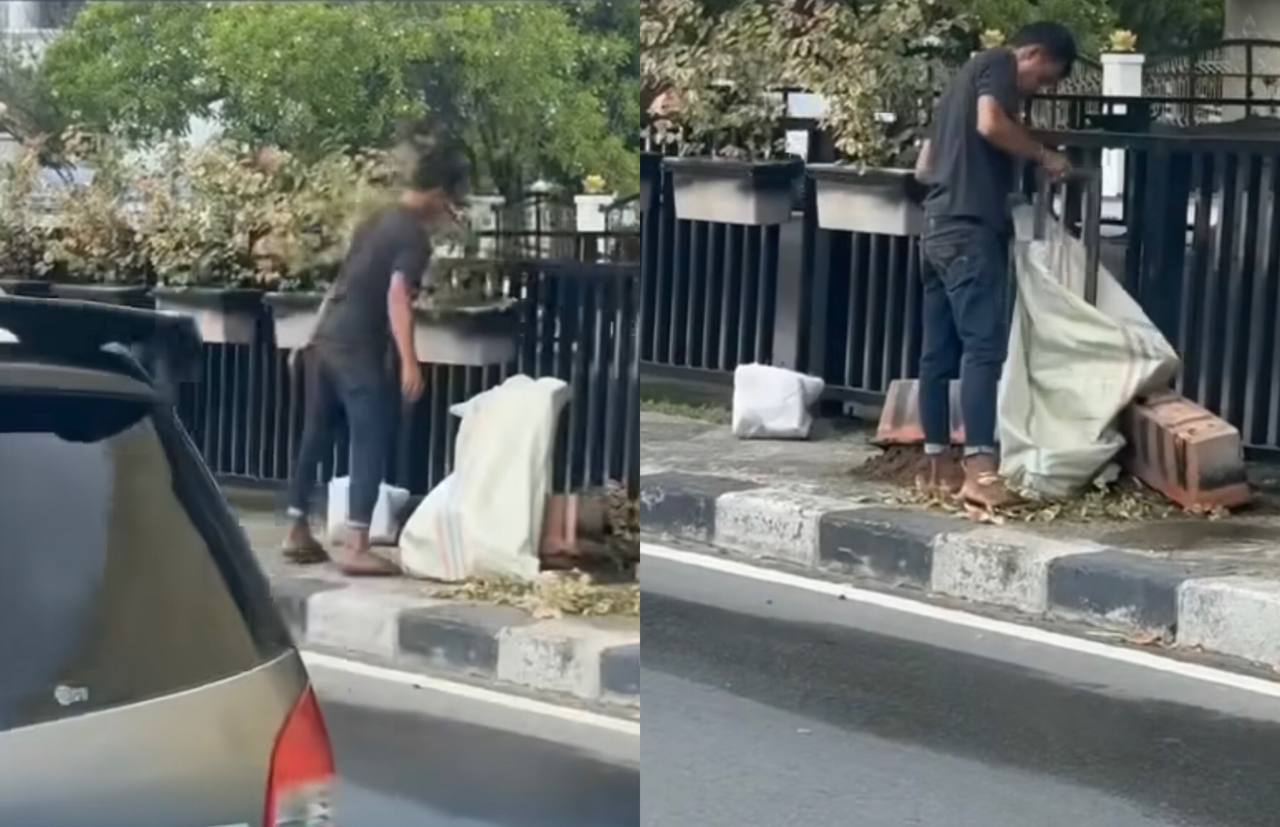 SDM Rendah! Seorang Pria Nekat Curi Pagar Besi Pembatas Jalan di Siang Hari